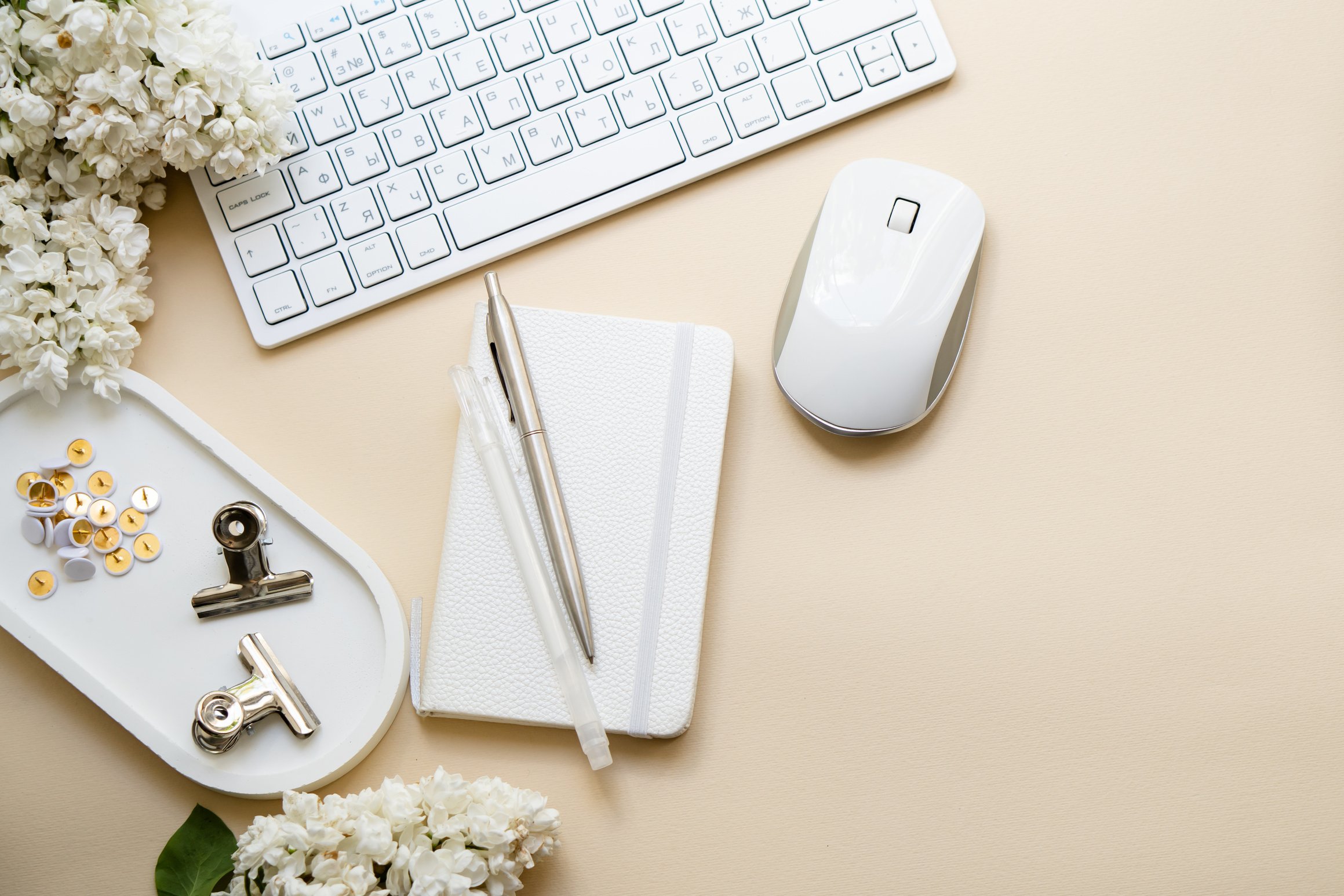 Keyboard and Mouse with Notebook on Neutral Background